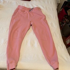Pink men’s Fabletics joggers, size Medium.